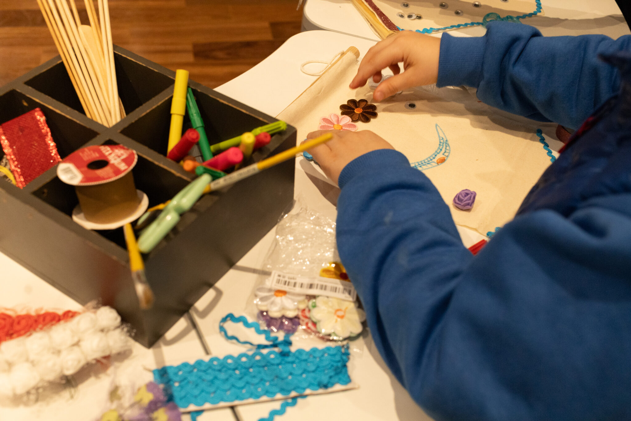 Child creates banner in workshop; my neighborhood has a history.
