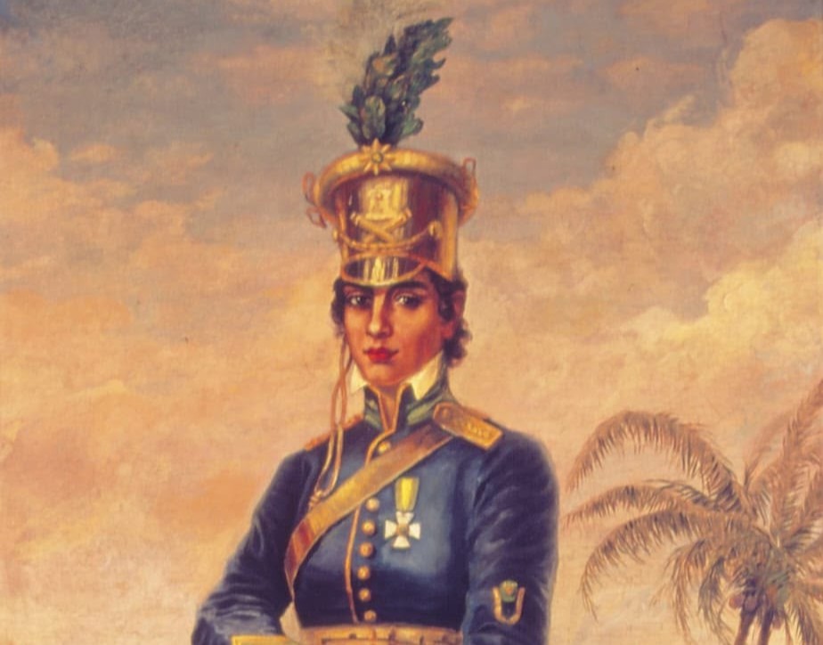 pintura vertical de Maria Quitéria a óleo (233 x 133 cm) que mostra Maria Quitéria de corpo inteiro, em pé, segurando um fuzil e voltada para uma paisagem ao fundo (inspirada no Rio Paraguaçu, na Bahia)